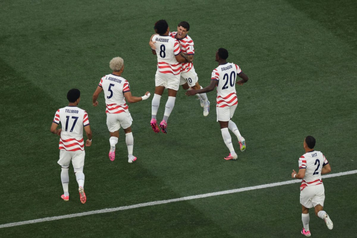 LOS ANGELES, CALIFORNIA - JUNE 12: Christian Pulisic #10 and Weston McKennie #8 of the United States celebrate their side's first goal, an own goal by Damian Bobadilla #16 of Paraguay (not pictured), during the FIFA World Cup 2026 Group D match between USA and Paraguay at Los Angeles Stadium on June 12, 2026 in Los Angeles, California. (Photo by Harry How/Getty Images)